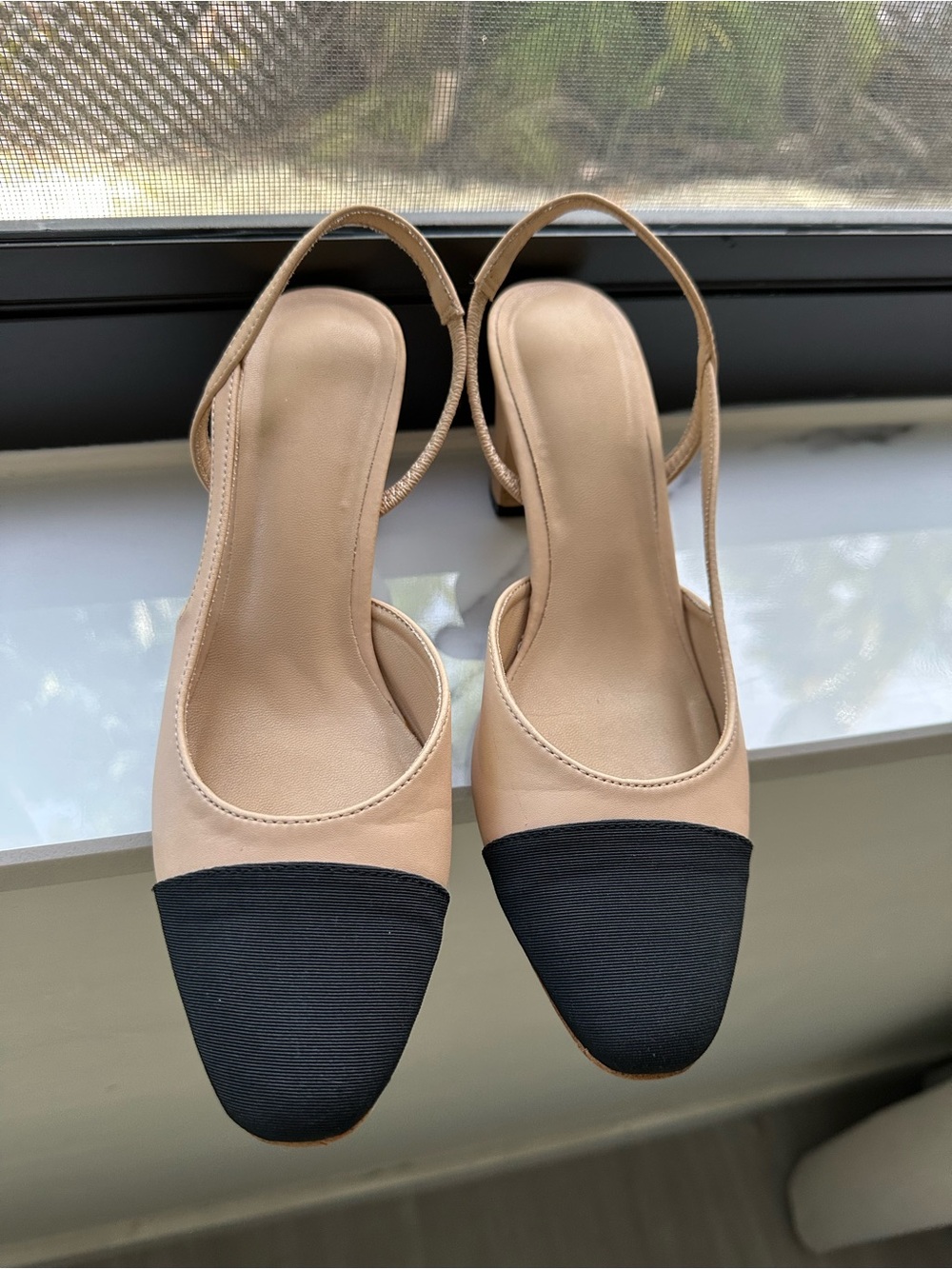 Two-Tone Beige and Black Slingback Pumps